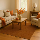 Elegant brown patterned rug with golden undertones for fall decor.